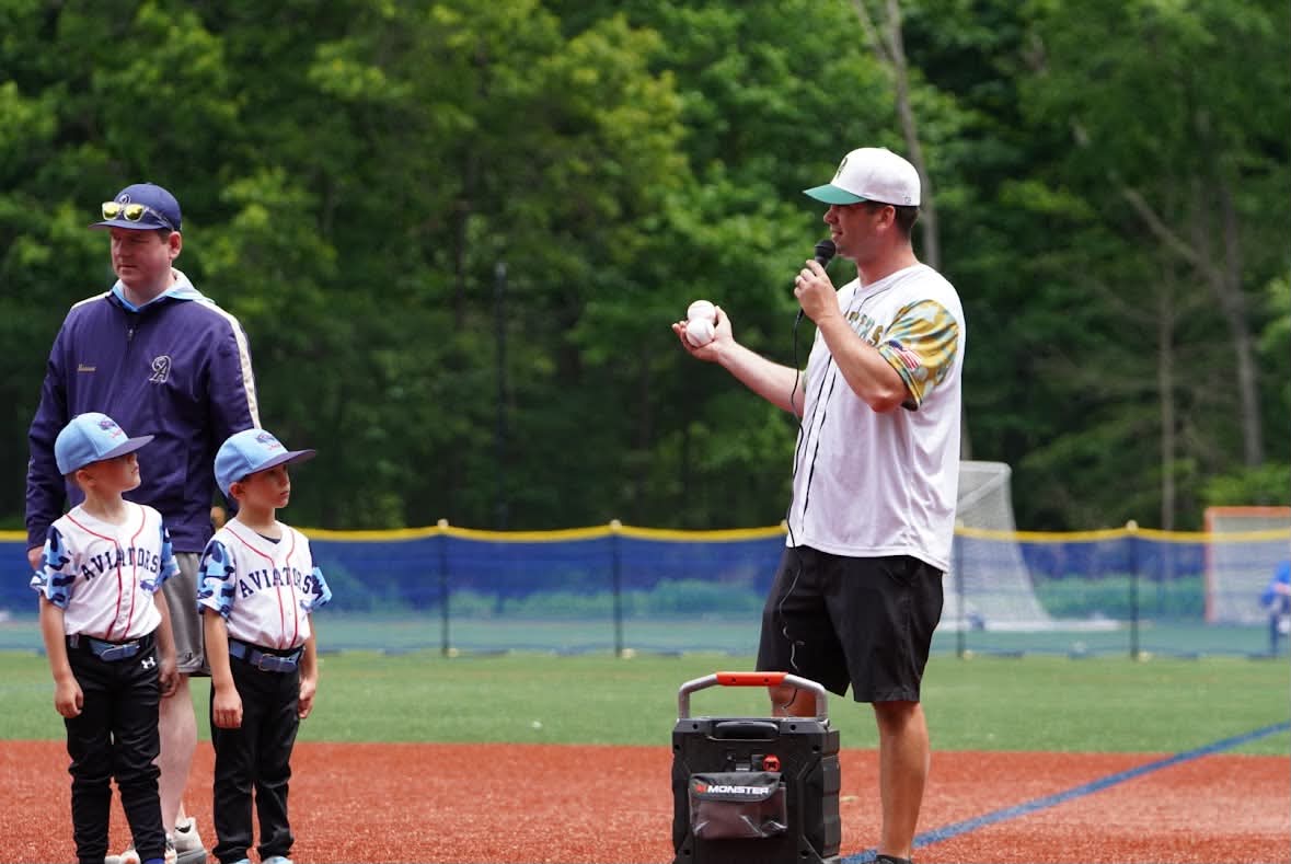 Coach Donlin speaking at a team ceremony